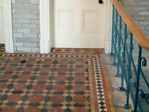 Quarry tiles on the landing after restoration. Photo by Careww-Cox.