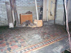 Quarry tiles on the landing before restoration. Photo by Alan Smith M.B.E.