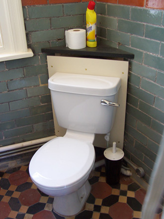 view of cloak room and toilet